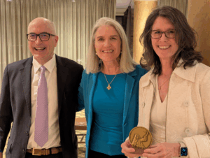 Image of FADICA's board chair, Michael Wolohan and FADICA President and CEO, Alexia Kelley with the St. Mary Magdalene Medal of Service recipient Anne Cullen Miller.